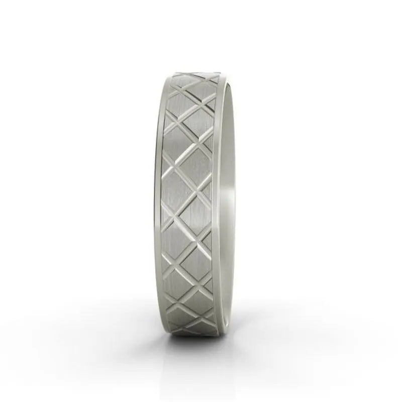 The Mitchell sterling silver wedding band showcases an elegant diamond-patterned design and is displayed upright against a plain white background.