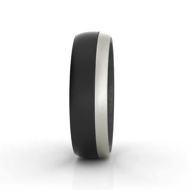 The Onyx carbon fibre wedding band, featuring a matte black exterior and a silver inner band, is displayed against a white background.