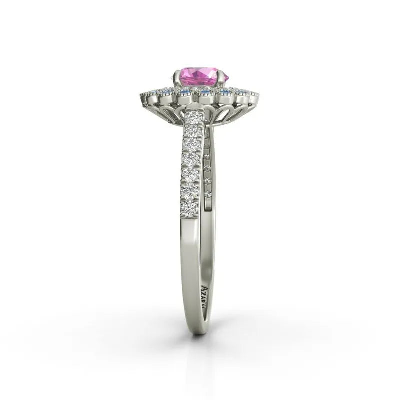 Side view of the Portia 9kt gold engagement ring, featuring a stunning pink gemstone surrounded by small clear stones on its radiant band.