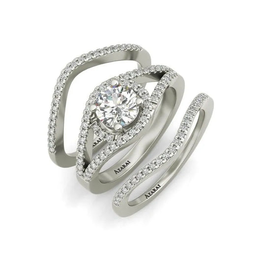 The Raquel sterling silver bridal set, currently available on clearance for a limited time, showcases a striking engagement ring adorned with a prominent central diamond and complemented by two diamond-encrusted bands, ideal for anyone pursuing elegance and sophistication.