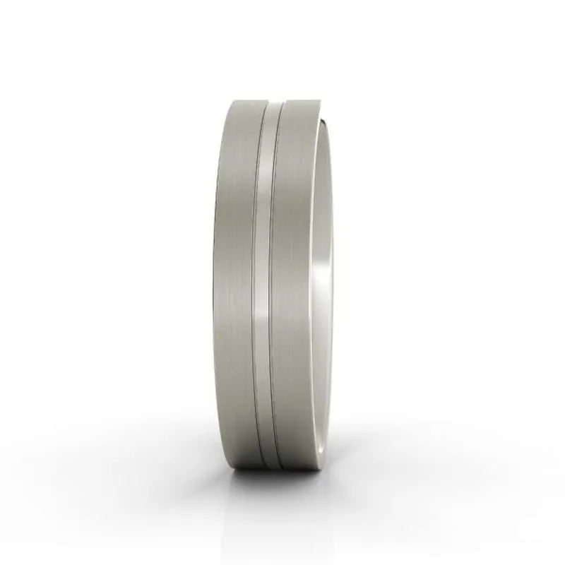 A Riley titanium wedding band features a brushed metal finish with two thin engraved lines encircling the band, elegantly positioned upright on a white background.