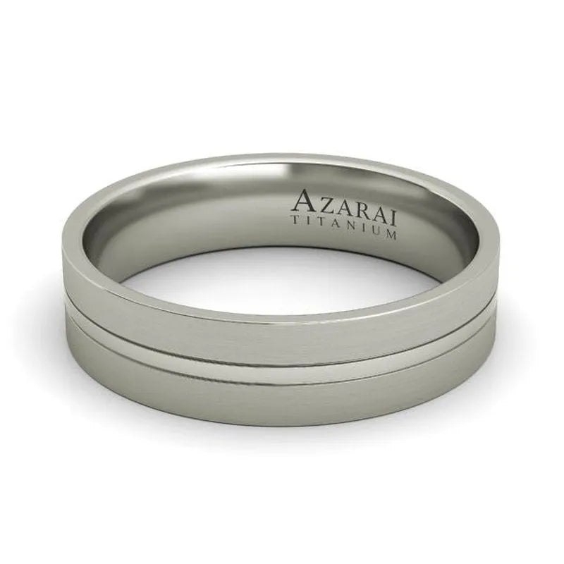 The Riley titanium wedding band boasts a sophisticated brushed finish and is inscribed with "AZARAI TITANIUM" on the interior, providing a blend of elegance and durability for an everlasting commitment.