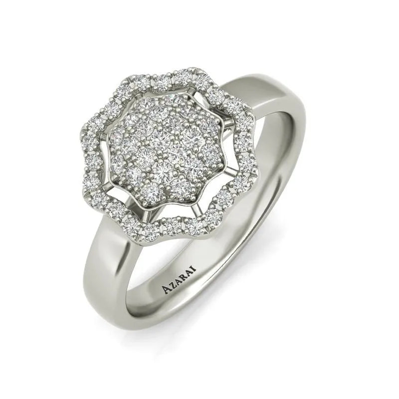 The Rosalyn sterling silver engagement ring showcases a flower-shaped cluster of small diamonds, encircled by a radiant halo, with the inscription "AZARAI." Ideal for those pursuing elegance at unbeatable clearance prices, this exquisite piece is now on final sale.