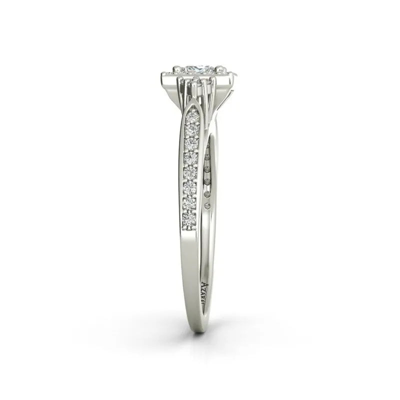 A side view of the Selma sterling silver engagement ring highlights a central diamond, beautifully surrounded by a row of smaller diamonds that are elegantly embedded along the band.