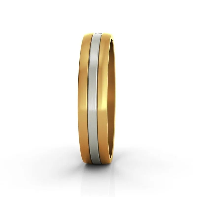 The Signia 9kt gold wedding band, a stunning two-toned ring of gold and silver, shines brilliantly on a white background. This elegant men's wedding band embodies timeless sophistication and style.