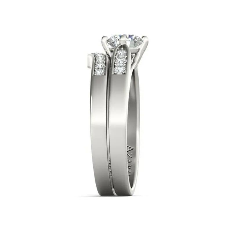 Side view of the Sofia sterling silver bridal set, showcasing a diamond solitaire enhanced by small inset diamonds on the band, ideal for creating a stunning ensemble.