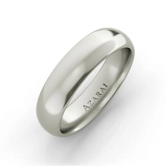 The Solis 18kt gold wedding band, measuring 5mm in width, features a smooth, polished surface with "AZARAI" elegantly engraved on the inside.