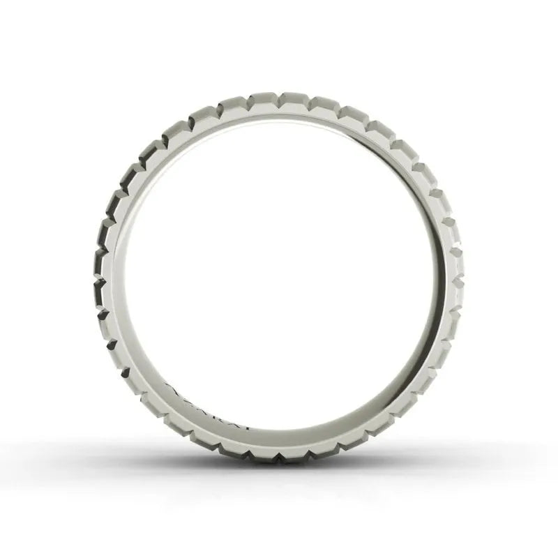 The Stafford sterling silver wedding band, featuring a white circular design with a notched edge, is viewed from the side against a plain white background.