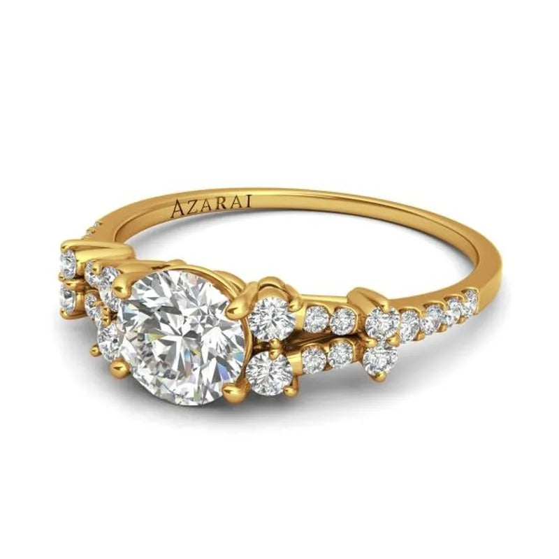 The Sweetheart 14kt gold engagement ring showcases a large central diamond complemented by smaller diamonds on the band, embodying timeless elegance.