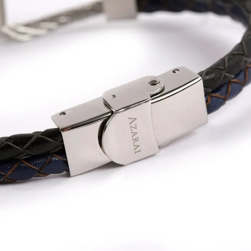 The Volte leather and stainless steel men's bracelet is designed with a woven blue and black pattern, featuring a silver clasp engraved with the word "AZARAI," and is enhanced by sleek stainless steel accents.